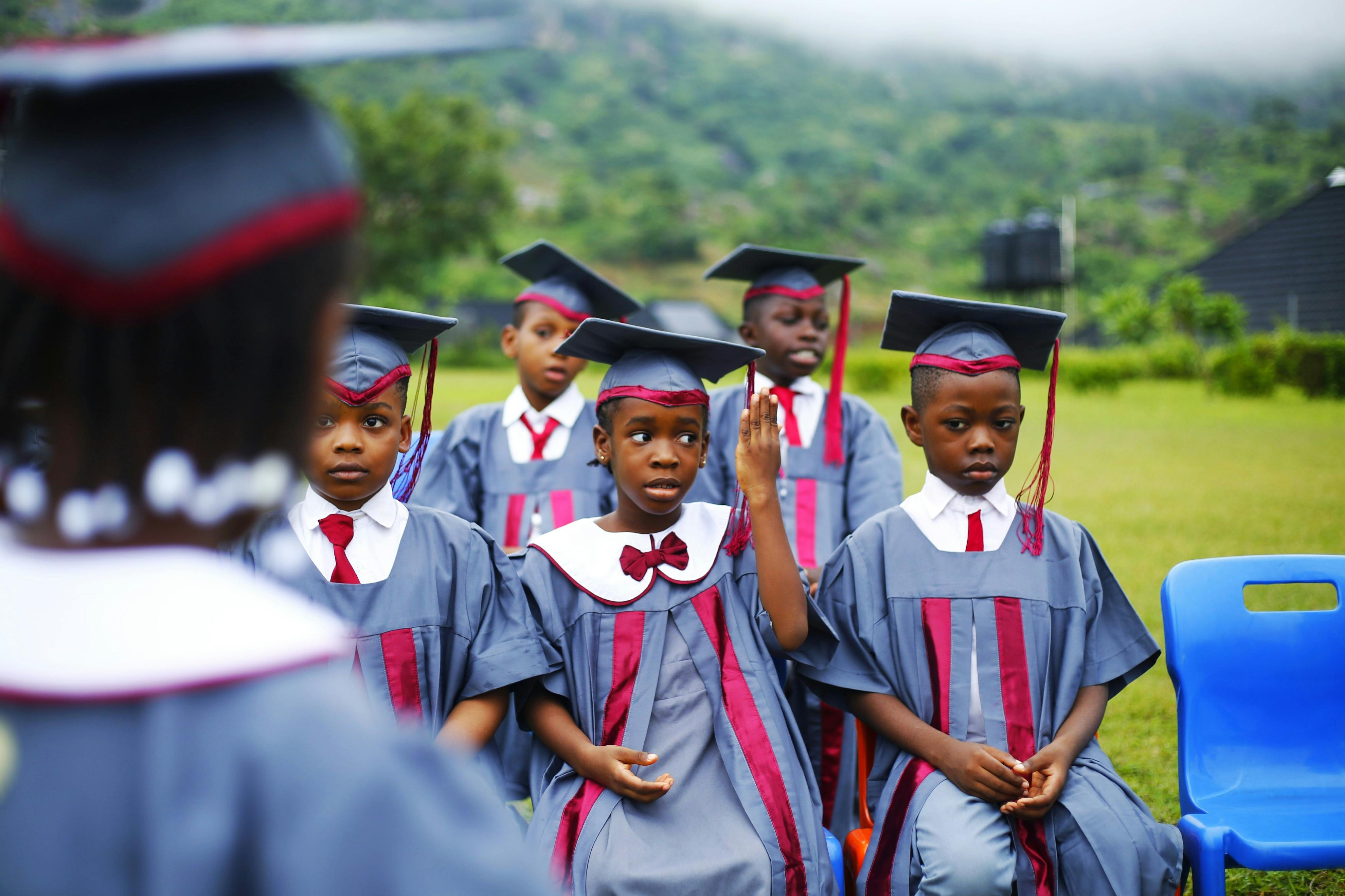 Pupils celebrating at the school graduation ceremony
