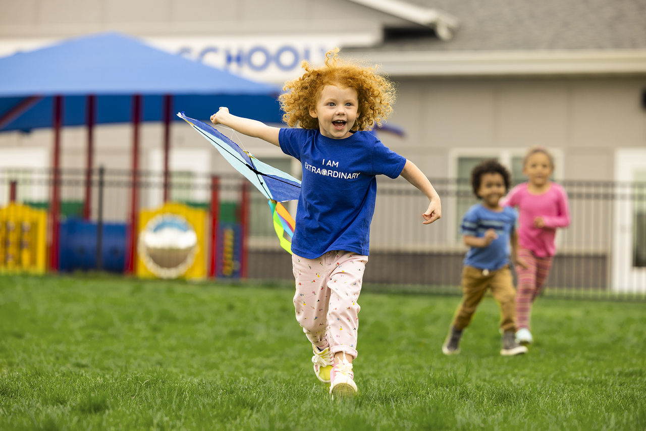 Children playing and running on the school playground