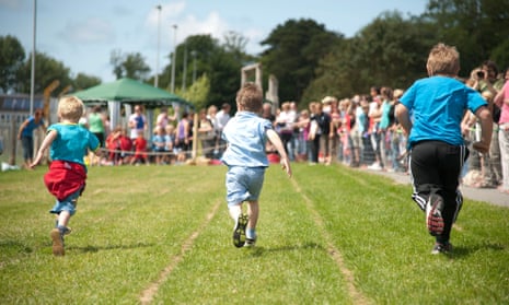 School pupils competing in athletics on the school field